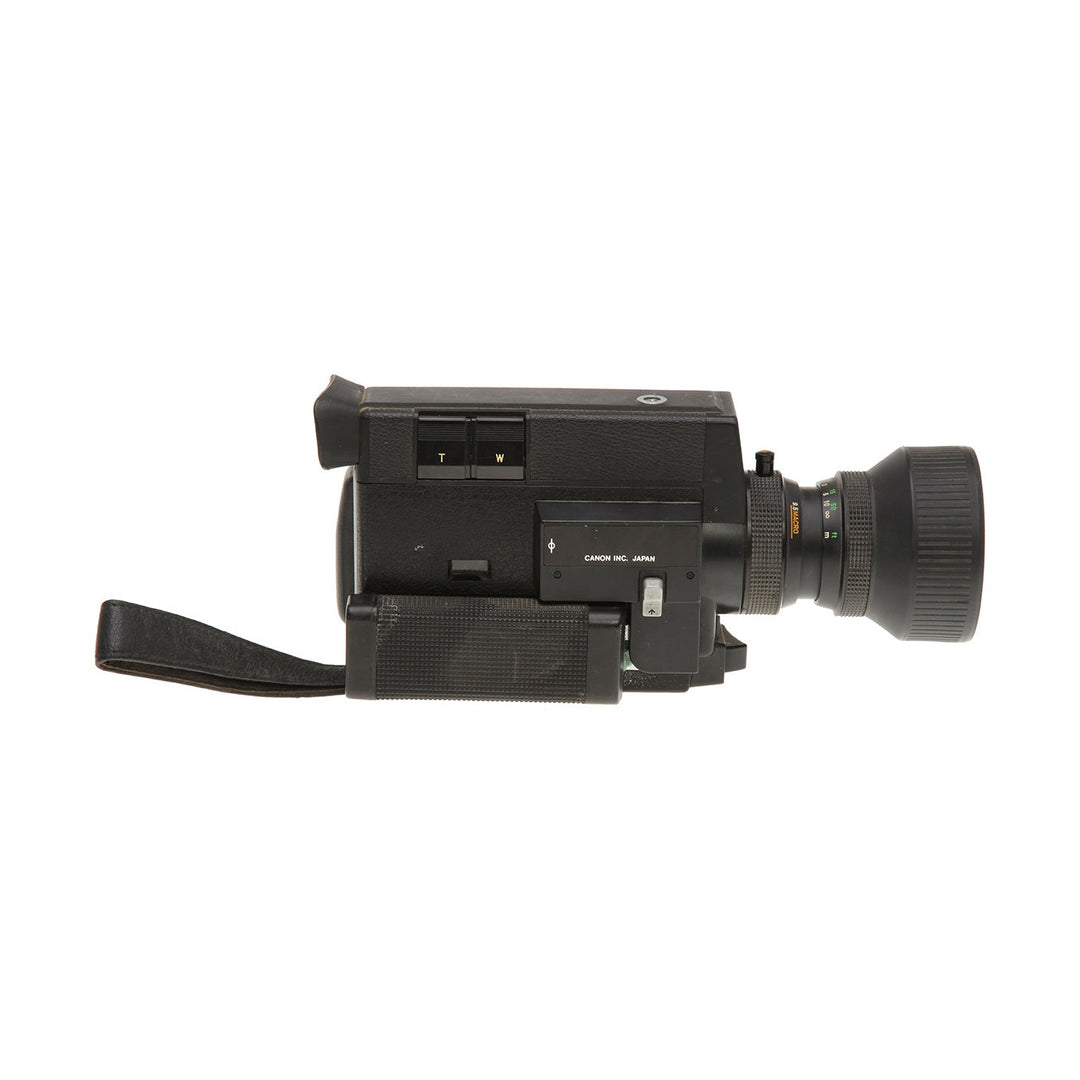 Side view of black Canon 512XL Super 8 film camera by ClubCamera.com showing zoom buttons and lens markings