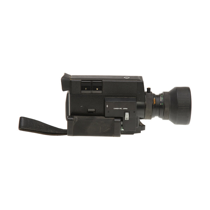 Side view of black Canon 512XL Super 8 film camera by ClubCamera.com showing zoom buttons and lens markings