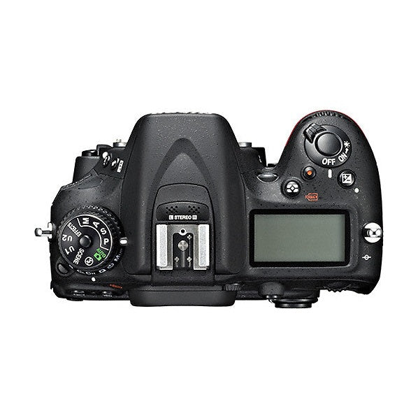 Top view of black Nikon D7100 DSLR with mode dial and flash sync port by ClubCamera.com