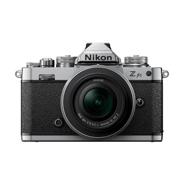 ClubCamera.com front view of silver Nikon Zfc retro camera with black leather-like grip and 16-50mm VR lens