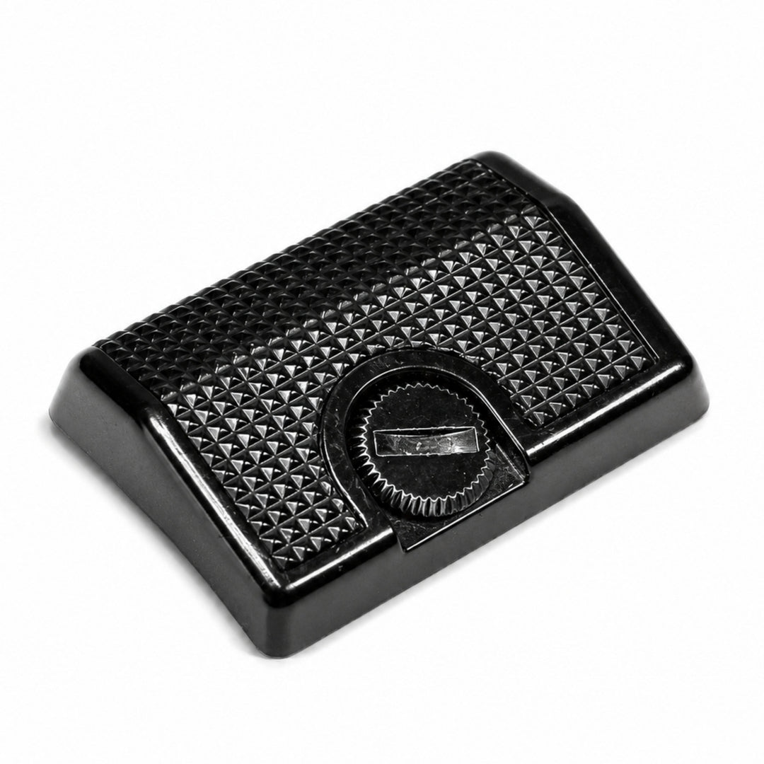 ClubCamera Canon AE-1 Program grip low-angle side view black plastic with textured pyramid surface