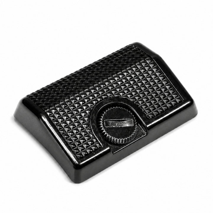 ClubCamera Canon AE-1 Program grip low-angle side view black plastic with textured pyramid surface