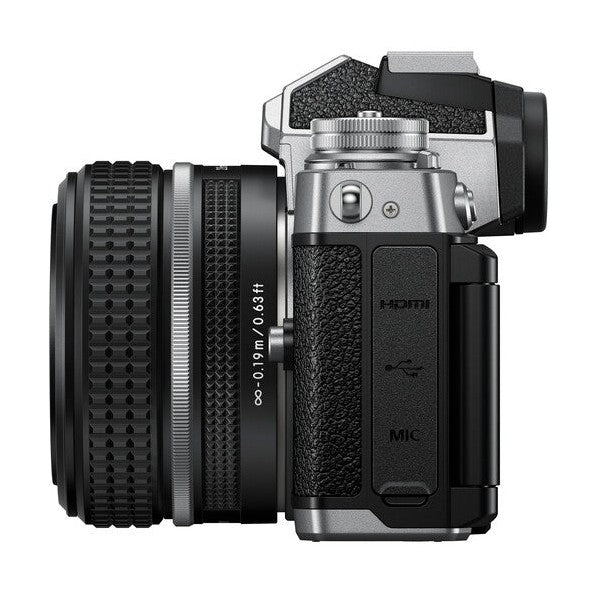 Side profile of Nikon Zfc showing HDMI USB-C ports and focus ring, ClubCamera.com