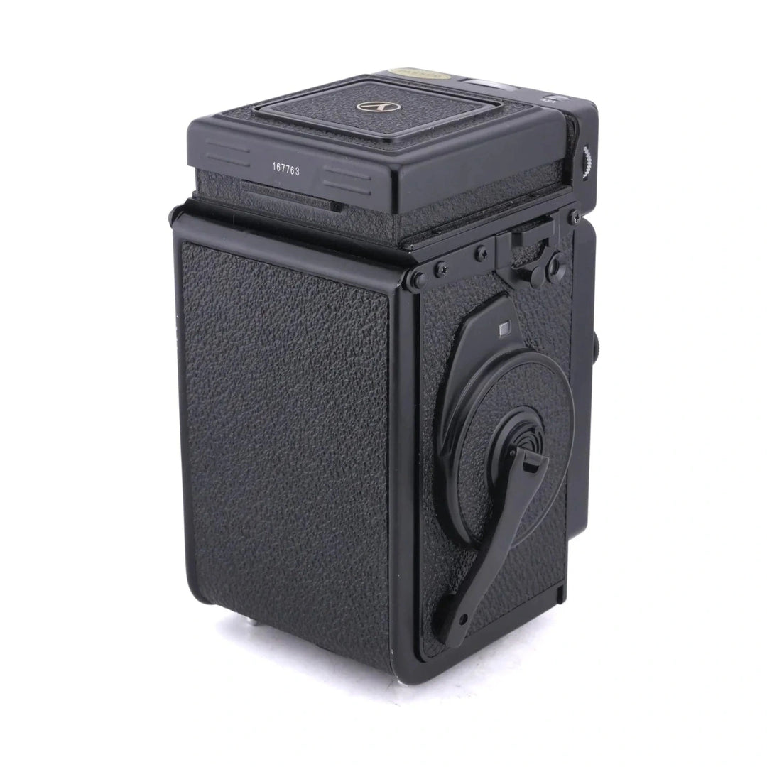 Rear view of black Yashica Mat-124G showing film rewind crank and serial number