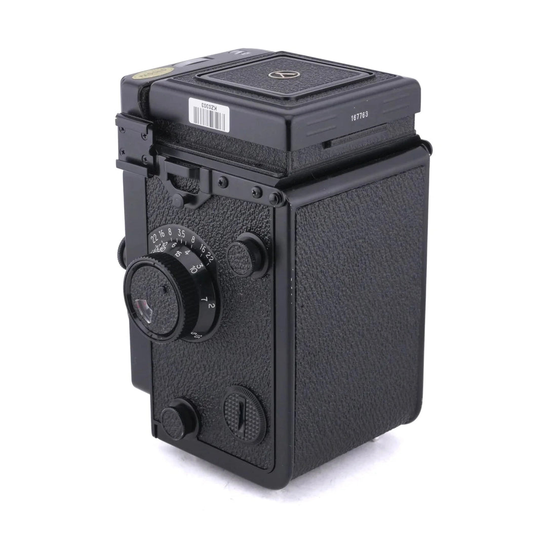 Left profile of vintage Yashica Mat-124G highlighting exposure controls and matte finish