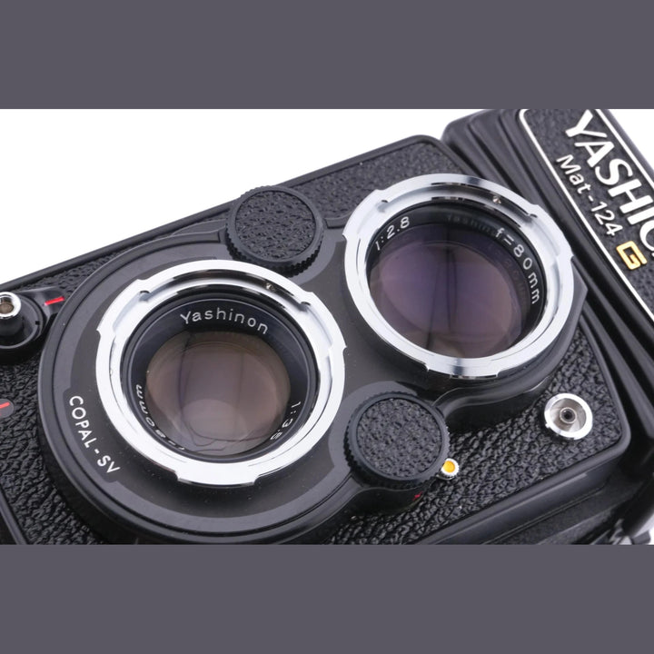 Yashica Mat-124G TLR camera top view with Yashinon lenses and ClubCamera.com branding