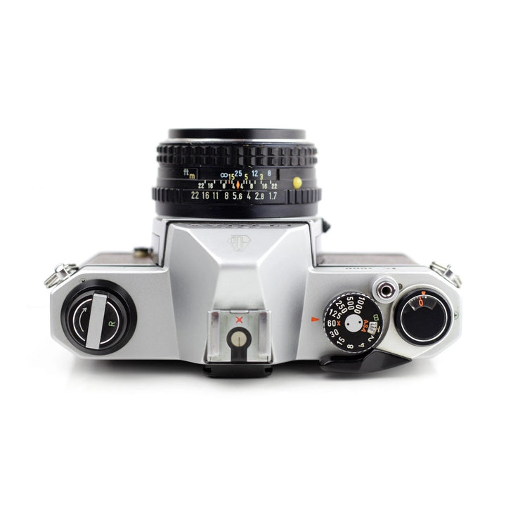 Pentax K1000 SE top-down view showing chrome shutter dial and mechanical controls at ClubCamera.com