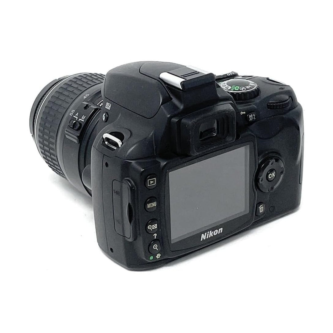 Black Nikon D40 DSLR camera rear view with LCD screen and mode dial by ClubCamera.com