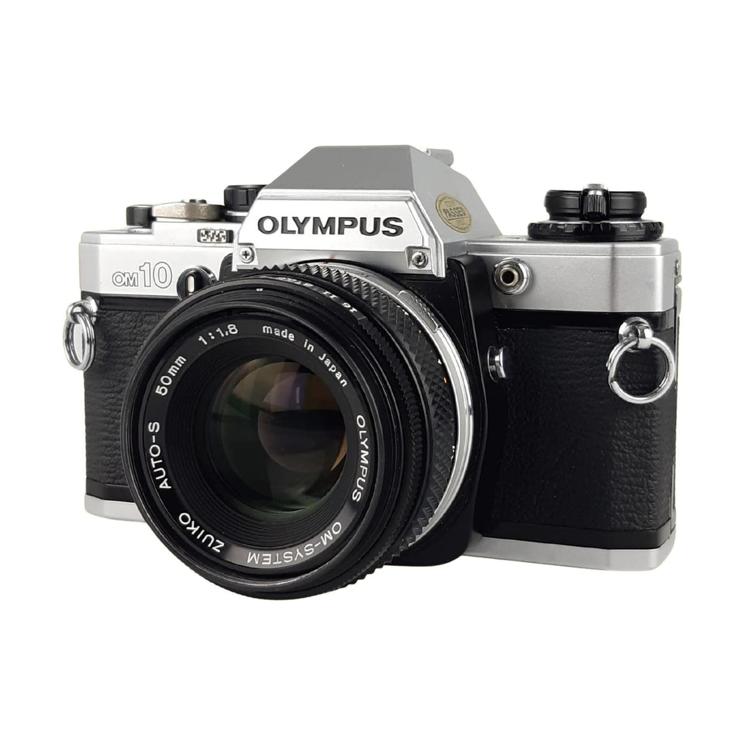 ClubCamera Olympus OM-10 35mm SLR film camera front angle with Zuiko 50mm f/1.8 lens and chrome mount ring