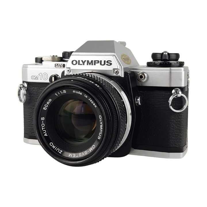 ClubCamera Olympus OM-10 35mm SLR film camera front angle with Zuiko 50mm f/1.8 lens and chrome mount ring