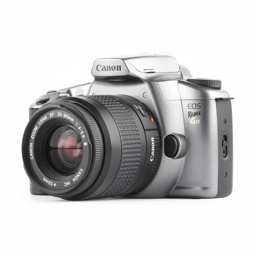 Three-quarter shot of lightweight silver Canon Rebel GII 35mm film SLR with EF zoom lens for beginners at ClubCamera.com