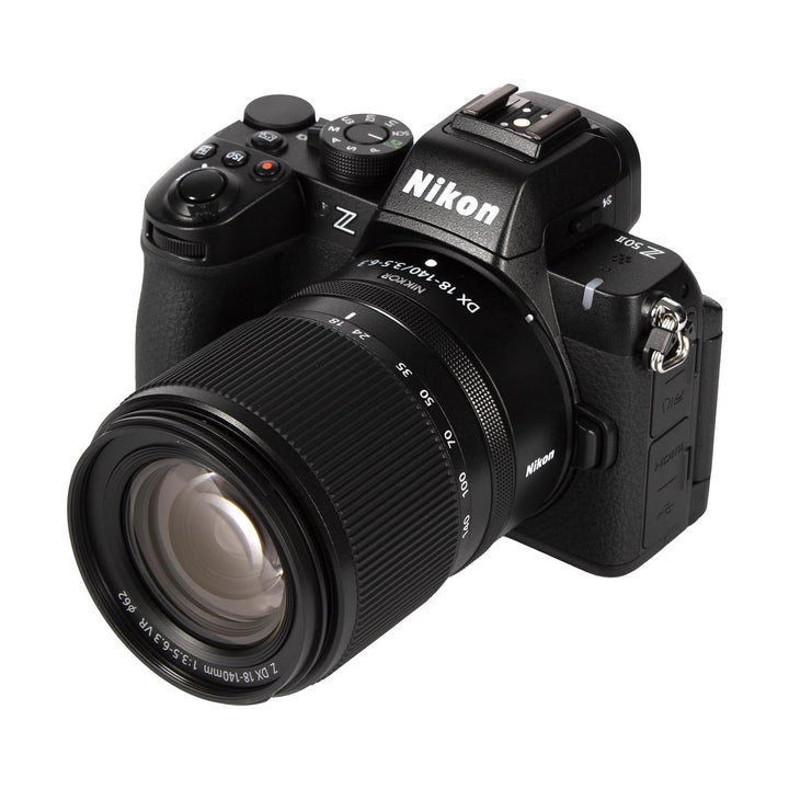 ClubCamera.com front view of black Nikon Z50II with Z DX 18-140mm VR lens showing mode dial and control layout