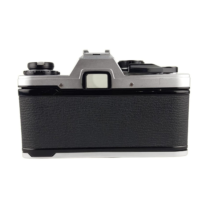 ClubCamera silver brushed aluminum Olympus OM-10 SLR film camera top-down view with black leatherette grip