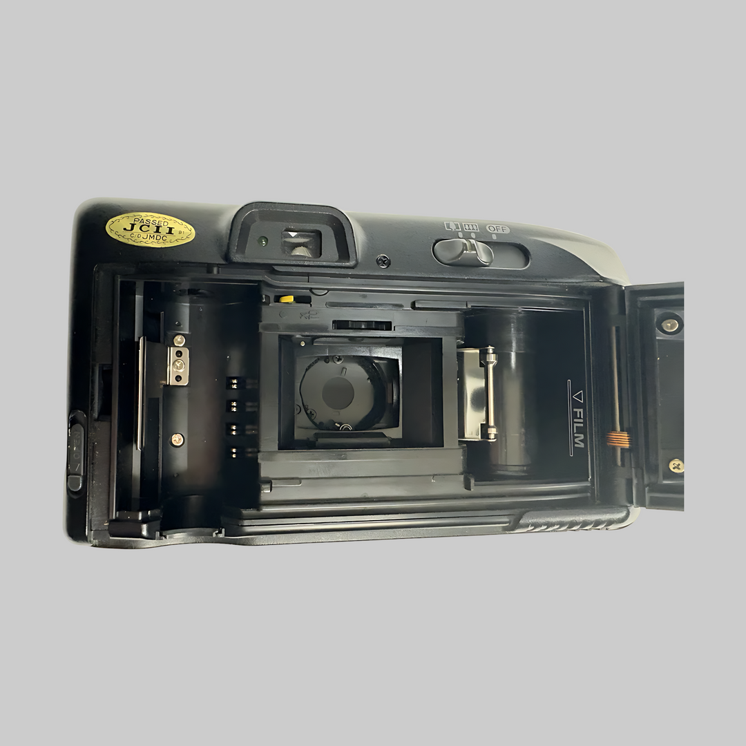Top-down open back of black Canon Sure Shot Multi Tele showing film gate and copper tensioner spring at ClubCamera.com
