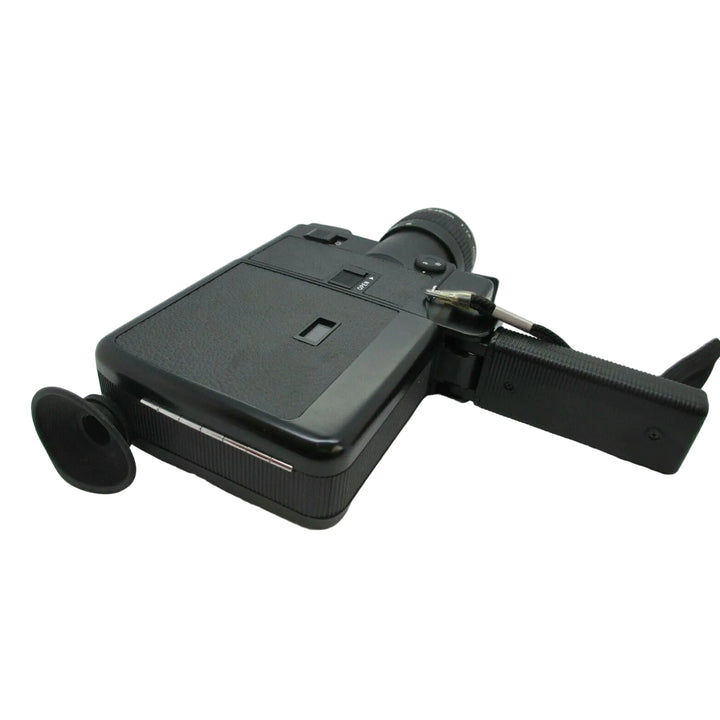 Rear view of black Canon 514XL Super 8 camera by ClubCamera.com featuring flip-down viewfinder and ribbed handgrip