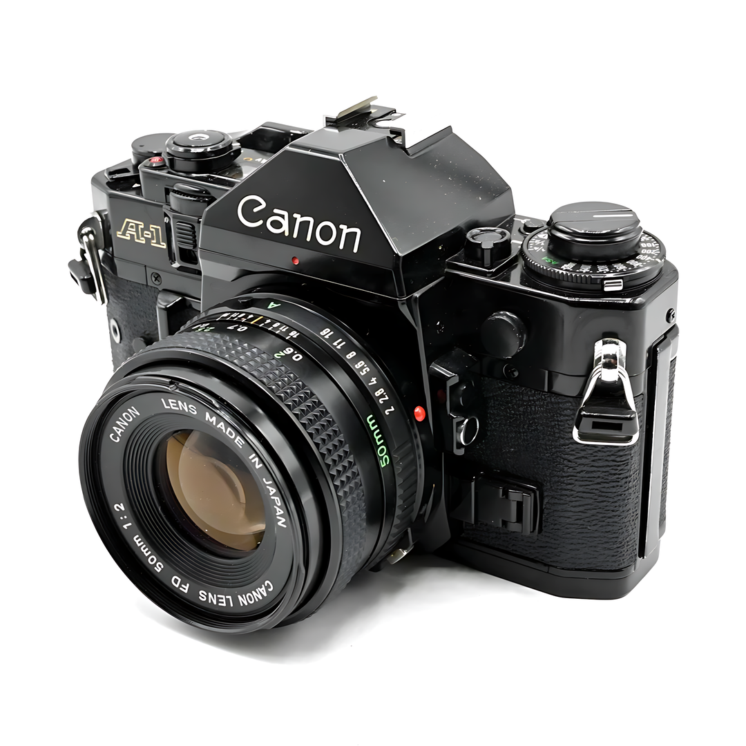 Side profile of black Canon A-1 35mm SLR with textured grip and FD 50mm f/2 lens at ClubCamera.com