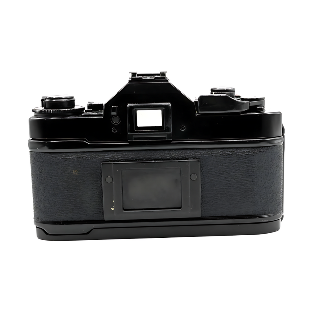 Rear view of vintage black Canon A-1 SLR body without lens showing rewind crank and grip texture at ClubCamera.com