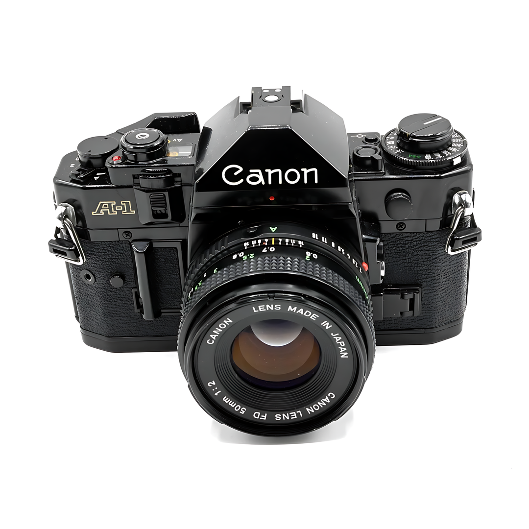 Front view of black Canon A-1 SLR with FD 50mm f/2 lens showing Av Tv M P modes at ClubCamera.com