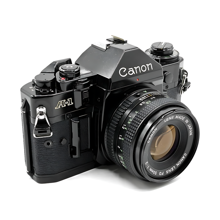 Black Canon A-1 35mm SLR film camera with FD 50mm lens and gold A-1 badge at ClubCamera.com