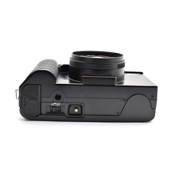 Black Canon AF35ML side profile showing hinged battery compartment and matte plastic finish from ClubCamera.com