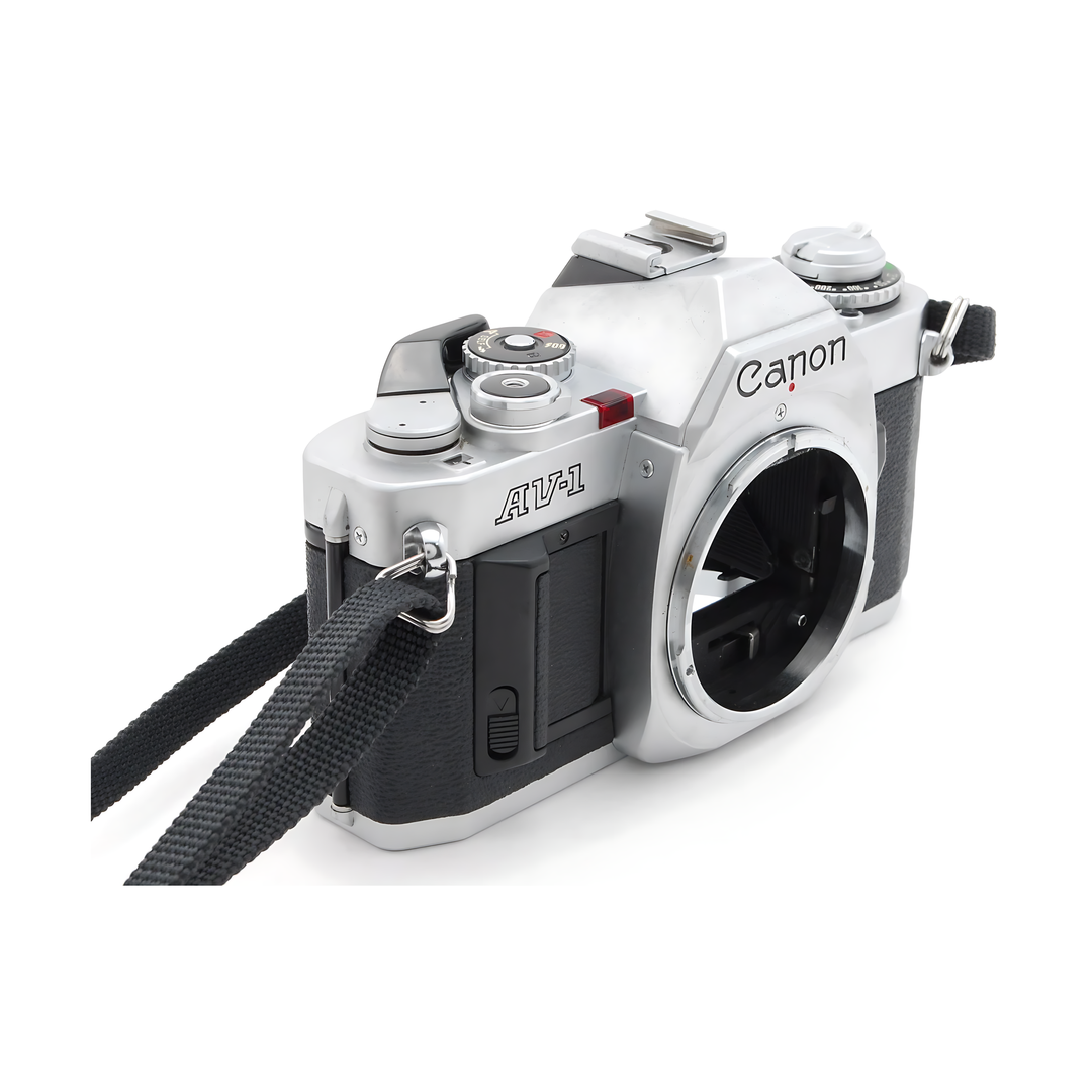 Canon AV-1 side view showing red exposure switch and rewind knob at ClubCamera.com