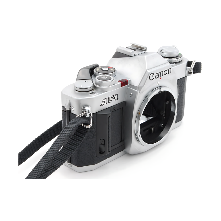 Canon AV-1 side view showing red exposure switch and rewind knob at ClubCamera.com
