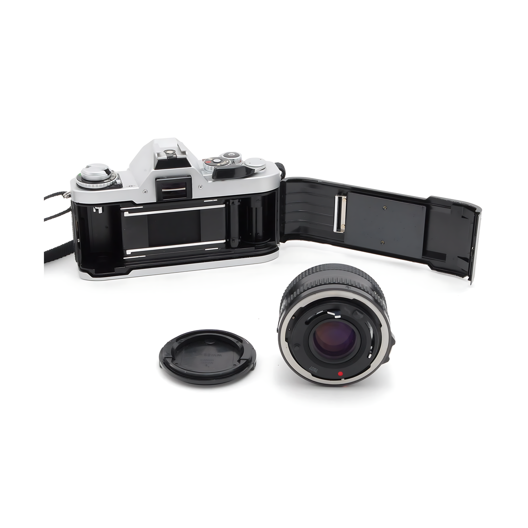 Canon AV-1 silver film camera open back with detached 50mm lens at ClubCamera.com