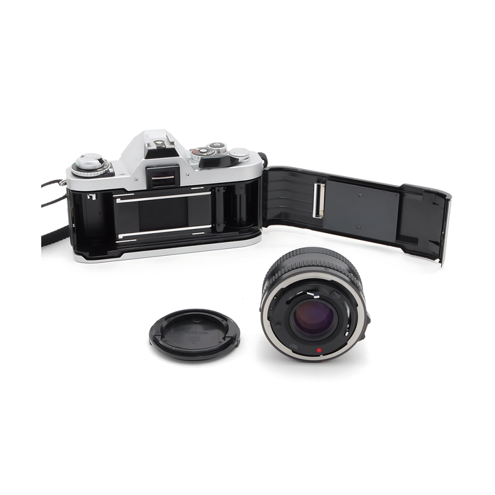 Canon AV-1 silver film camera open back with detached 50mm lens at ClubCamera.com