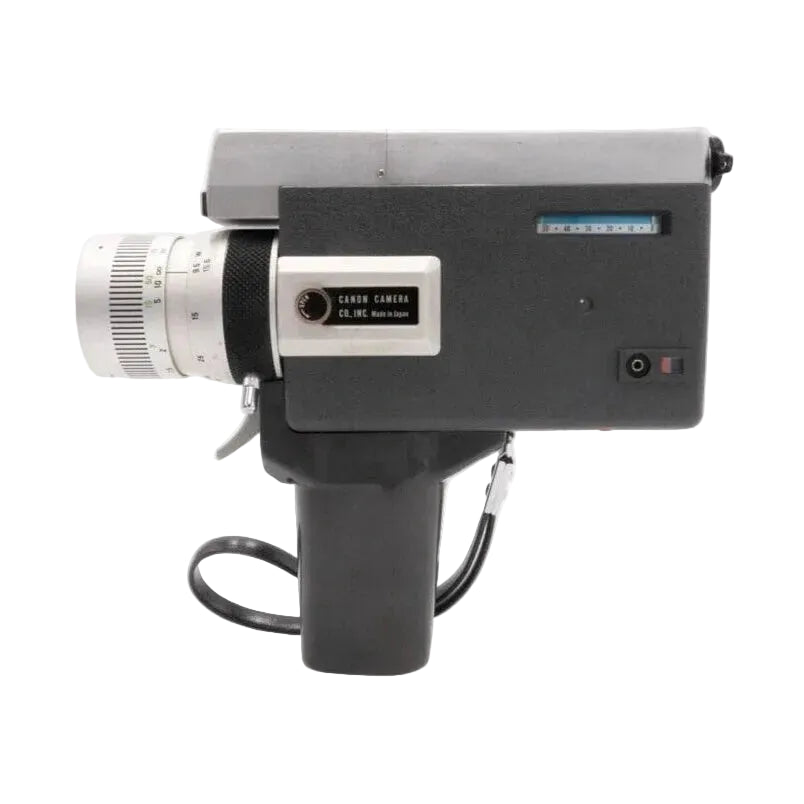 Rear view of Canon Auto Zoom 518 Super 8 cine camera with fixed handle by ClubCamera.com, showing Made in Japan label and blue film counter window