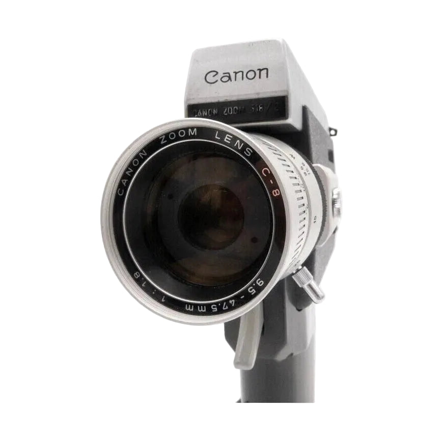 Canon Auto Zoom 518 Super 8 movie camera with fixed handle by ClubCamera.com, silver and black body featuring engraved CANON ZOOM LENS C-8 ring
