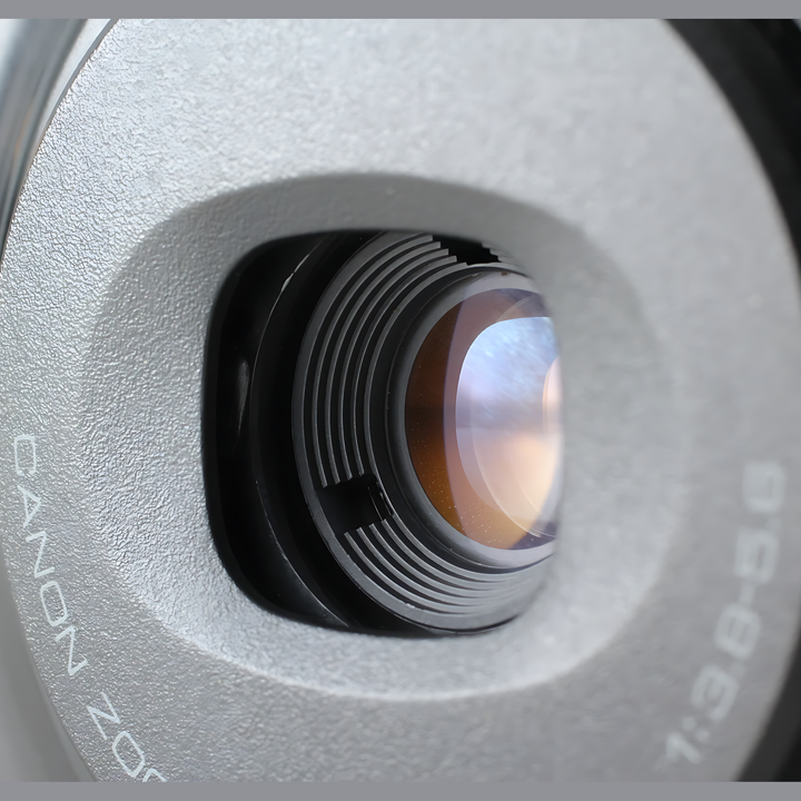 Close-up of Canon Autoboy Panorama 35mm zoom lens barrel showing focus rings and glass elements at ClubCamera.com
