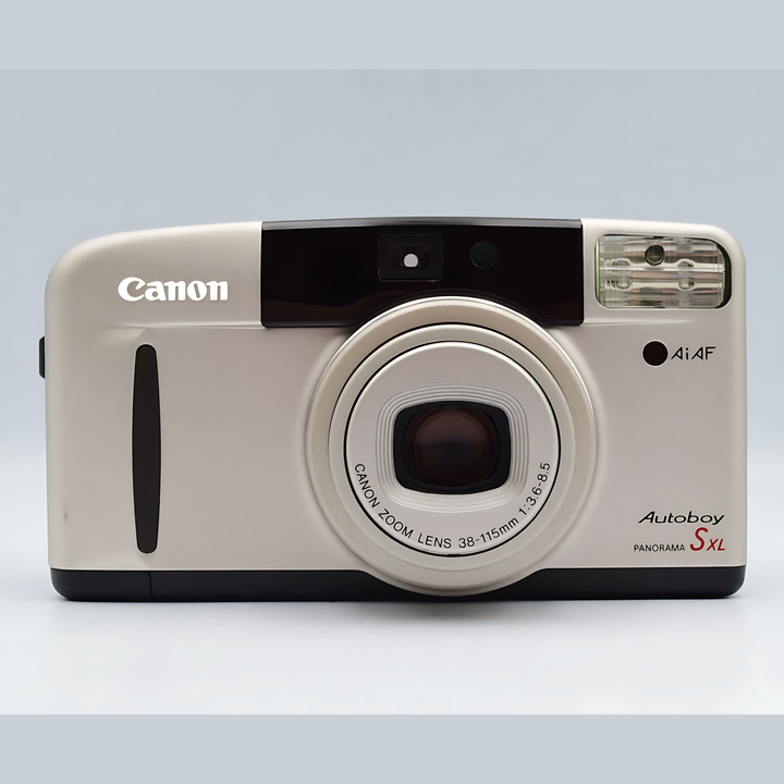Off-white Canon Autoboy S II XL panorama camera featuring large circular zoom lens and red branding text on matte body from ClubCamera.com
