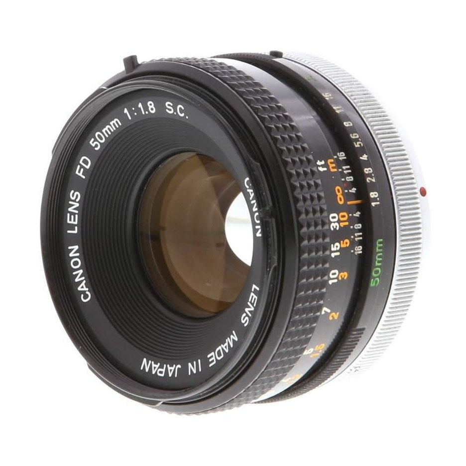 Canon FD 50mm f/1.8 manual focus lens with engraved specs and textured silver ring at ClubCamera.com