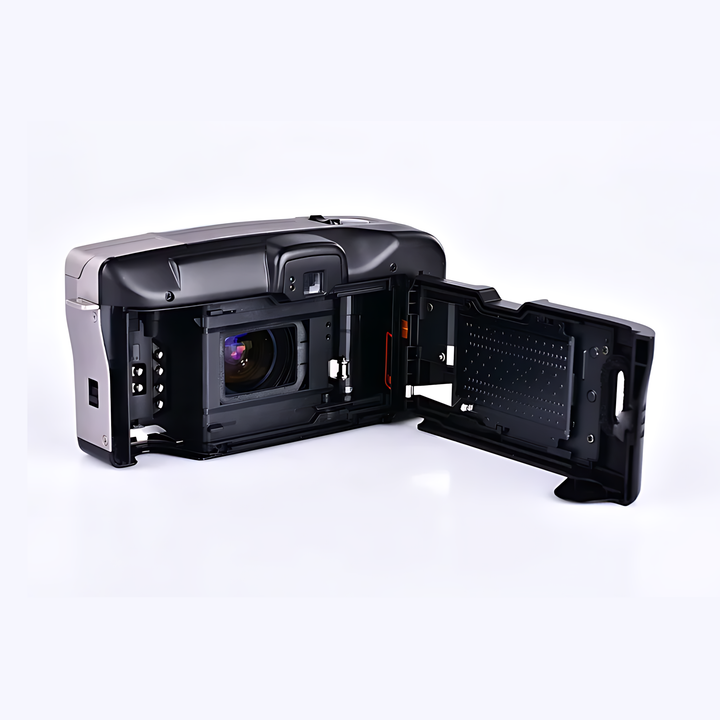 Black Canon Prima Super 135 film camera with open back panel revealing internal compartment and textured flash access at ClubCamera.com