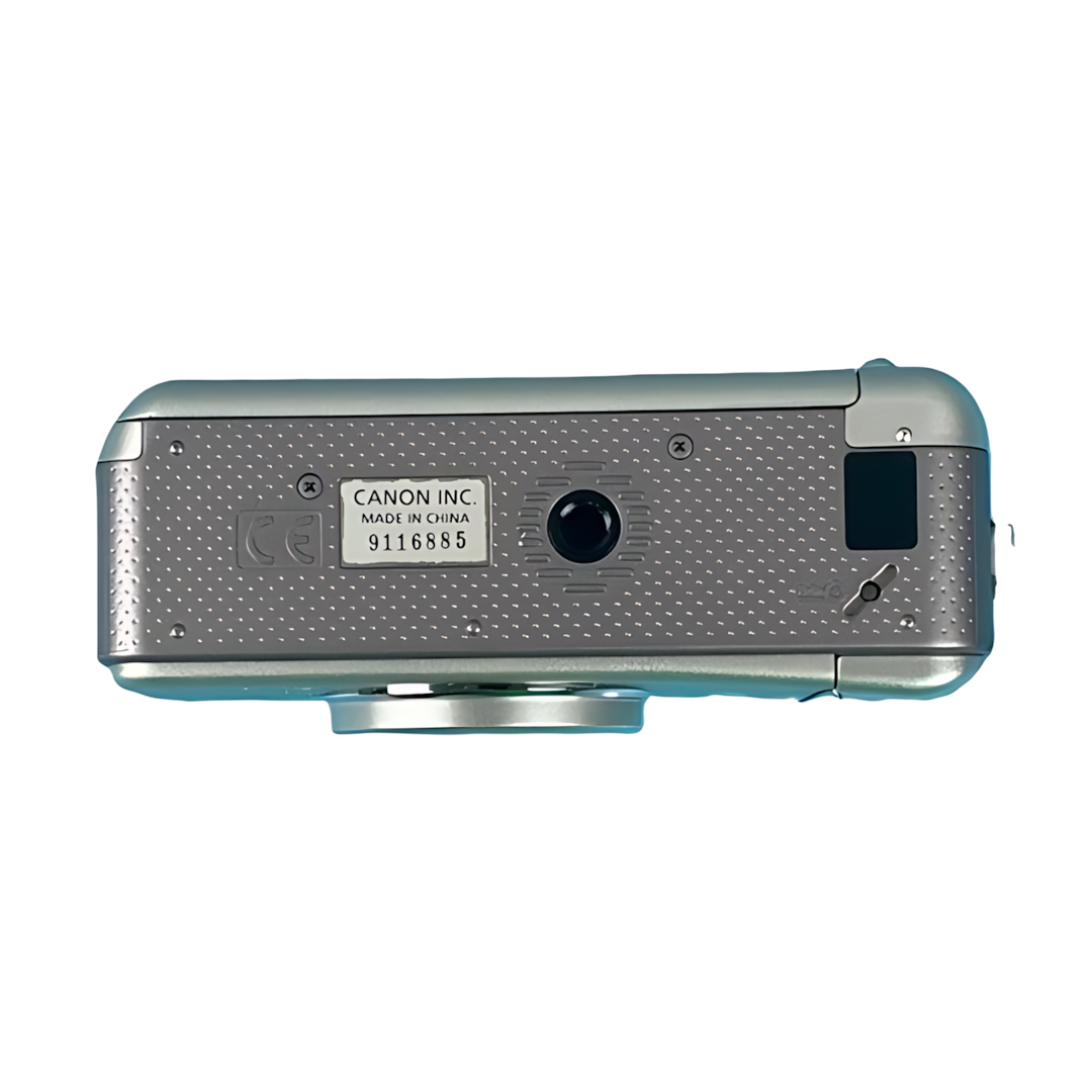 Bottom of silver Canon Sure Shot 115u with tripod mount and Made in China label from ClubCamera.com