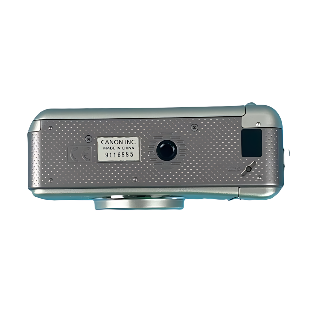 Bottom of silver Canon Sure Shot 115u with tripod mount and Made in China label from ClubCamera.com