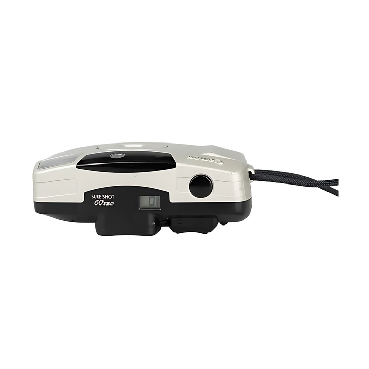 Side profile of cream Canon Sure Shot 60 Zoom showing shutter button, LCD date display, and ergonomic grip