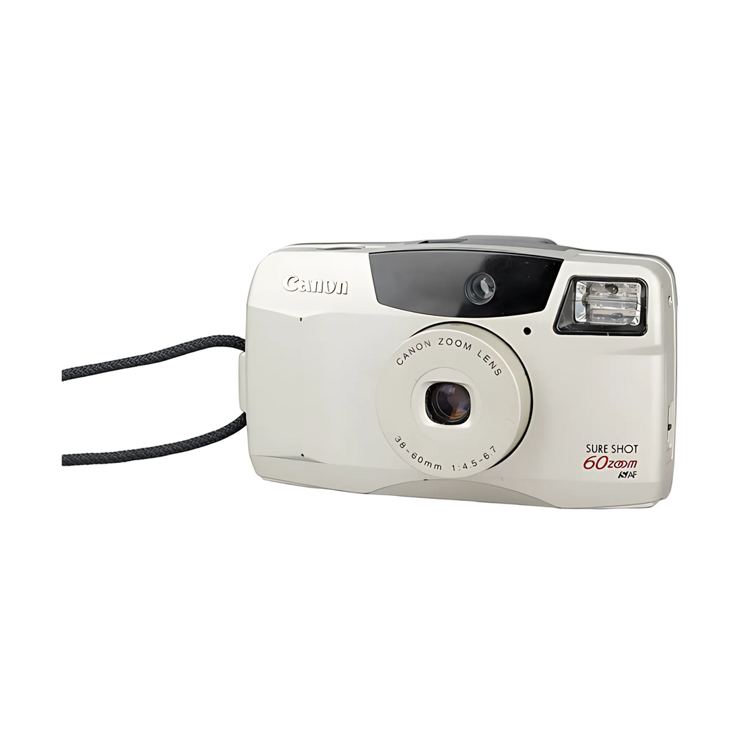 Cream Canon Sure Shot 60 Zoom film camera with retractable lens and black strap at ClubCamera.com