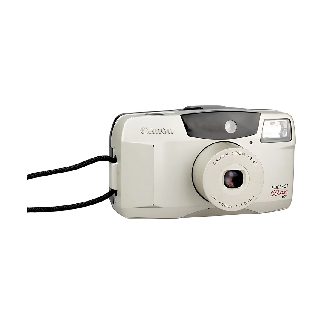 Three-quarter view of cream Canon Sure Shot 60 Zoom 35mm camera highlighting flash and lens ring details