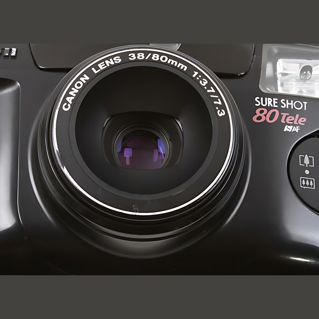 Close-up of Canon Sure Shot 80 Tele lens barrel engraved with 38/80mm specs