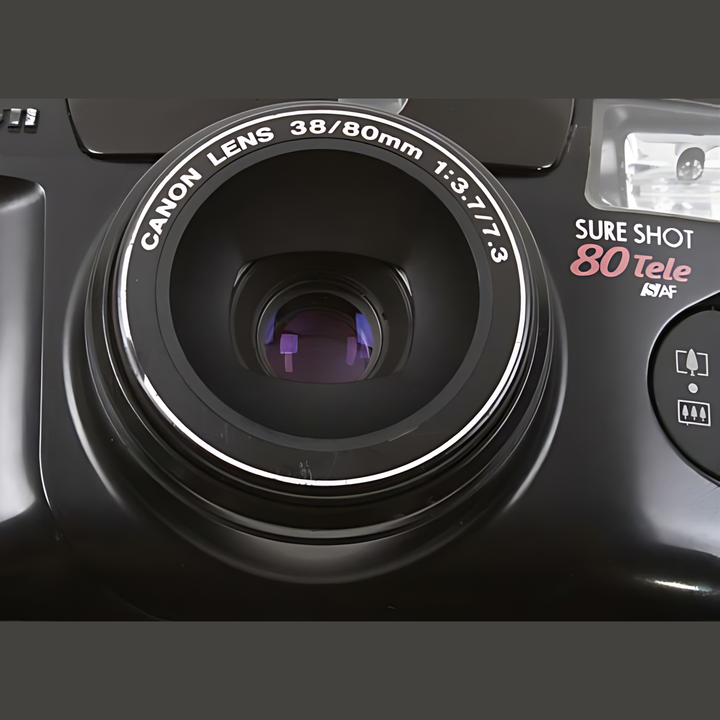 Close-up of Canon Sure Shot 80 Tele lens barrel engraved with 38/80mm specs
