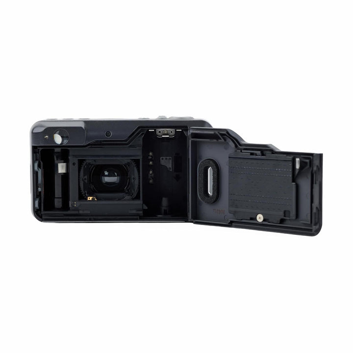 Open black Canon Sure Shot 90u film compartment showing internal gears and spool hub at ClubCamera.com