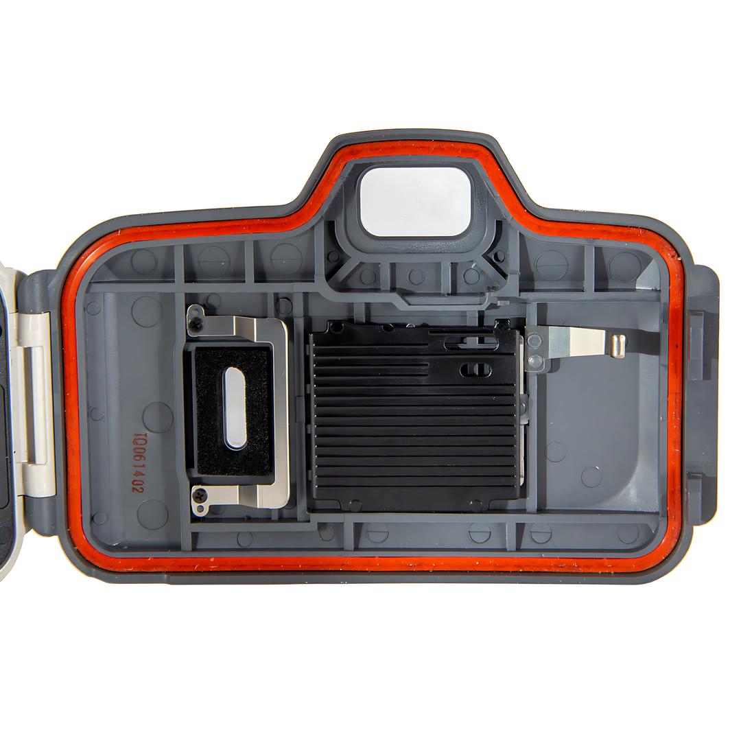Internal view of Canon Sure Shot A-1 waterproof housing with orange sealing gasket and film chamber