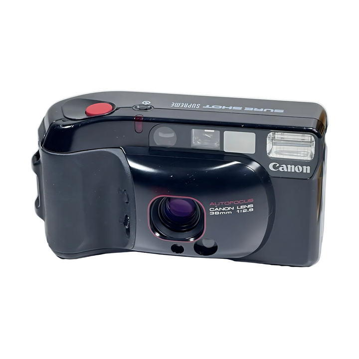 Front view of Canon Sure Shot Supreme 35mm point-and-shoot camera with red shutter button, purple lens, and autofocus label from ClubCamera.com
