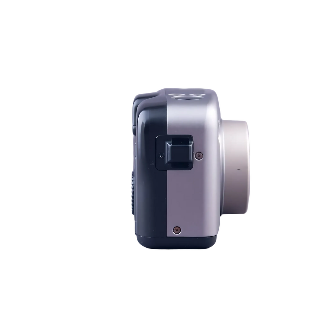 Side profile Canon Sure Shot Z115 highlighting dual-tone finish and ergonomic contours