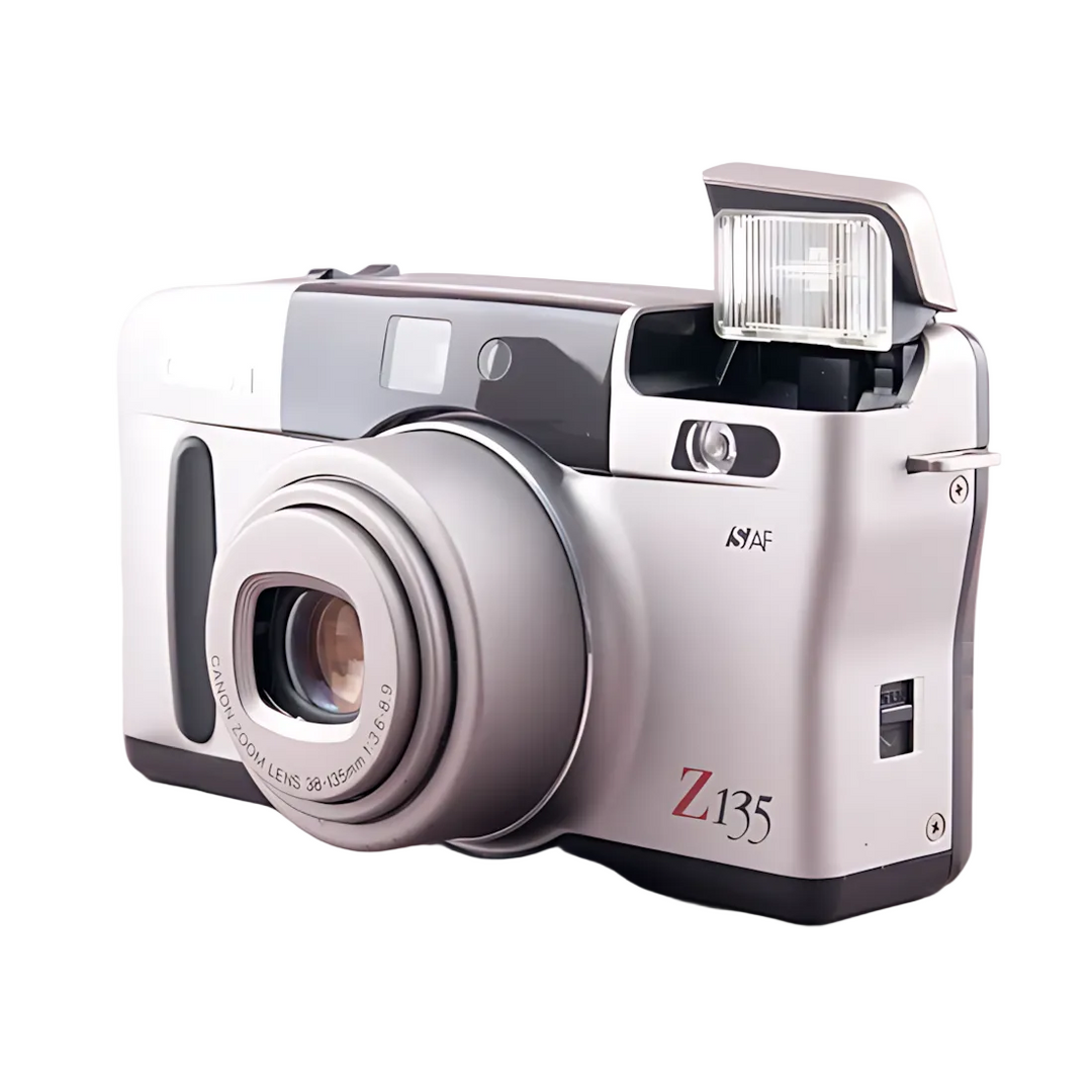 Silver Canon Sure Shot Z135 Zoom with raised pop-up flash and 38-135mm lens detail