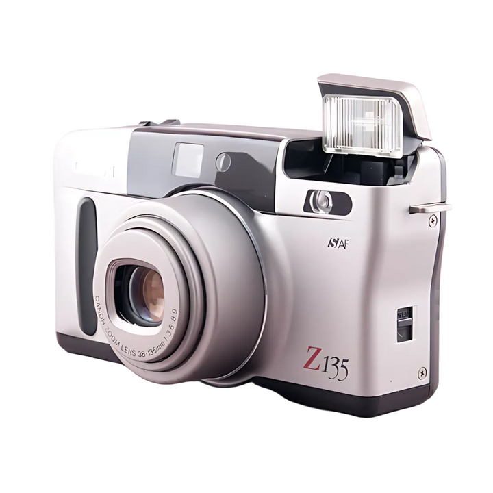 Silver Canon Sure Shot Z135 Zoom with raised pop-up flash and 38-135mm lens detail