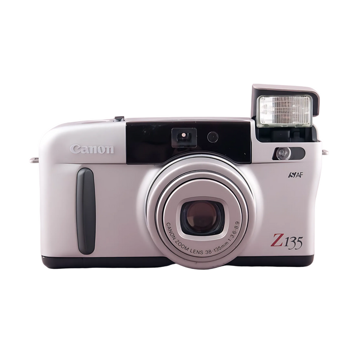 Full front profile of silver Canon Sure Shot Z135 Zoom with ISY AF marking and engraved lens text