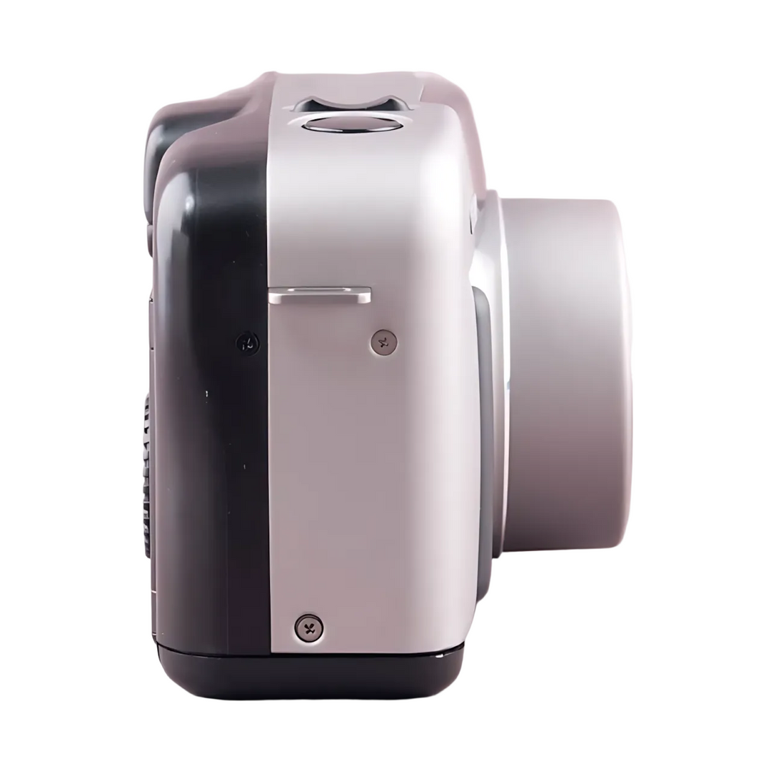 Side profile of silver and black Canon Sure Shot Z135 Zoom highlighting textured grip and screws