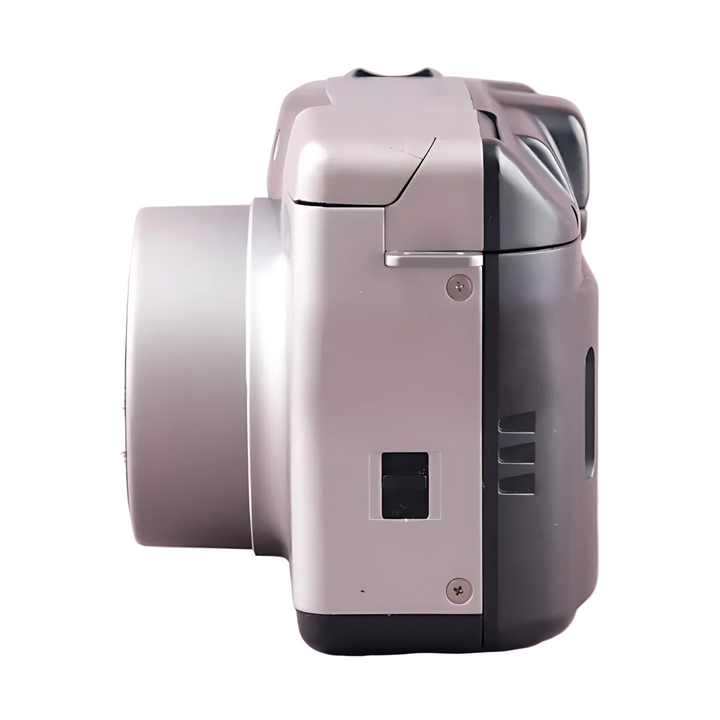 Side silhouette of silver and black Canon Sure Shot Z135 Zoom with battery compartment and vent slots
